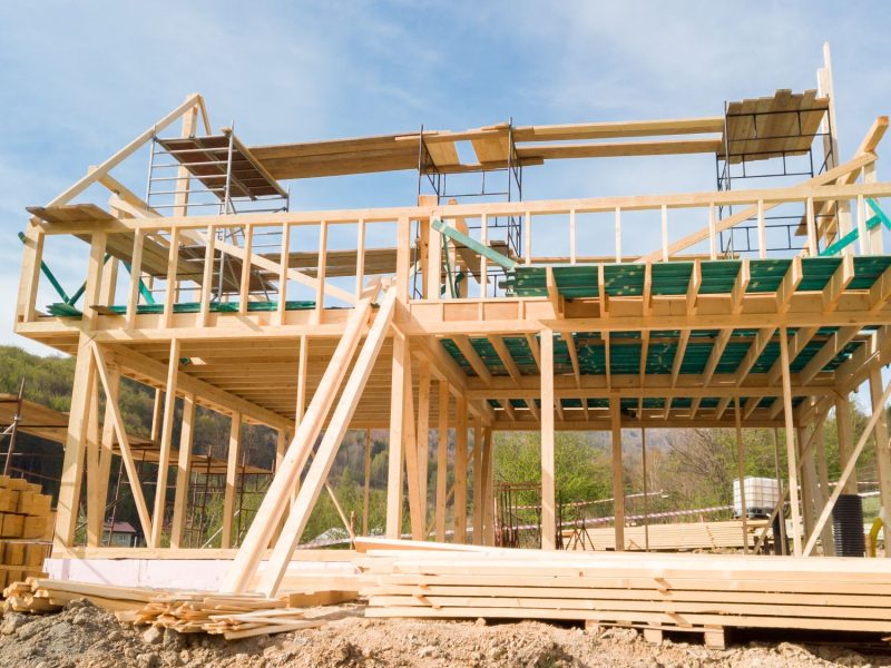 framing-of-a-new-wooden-house-under-construction-small
